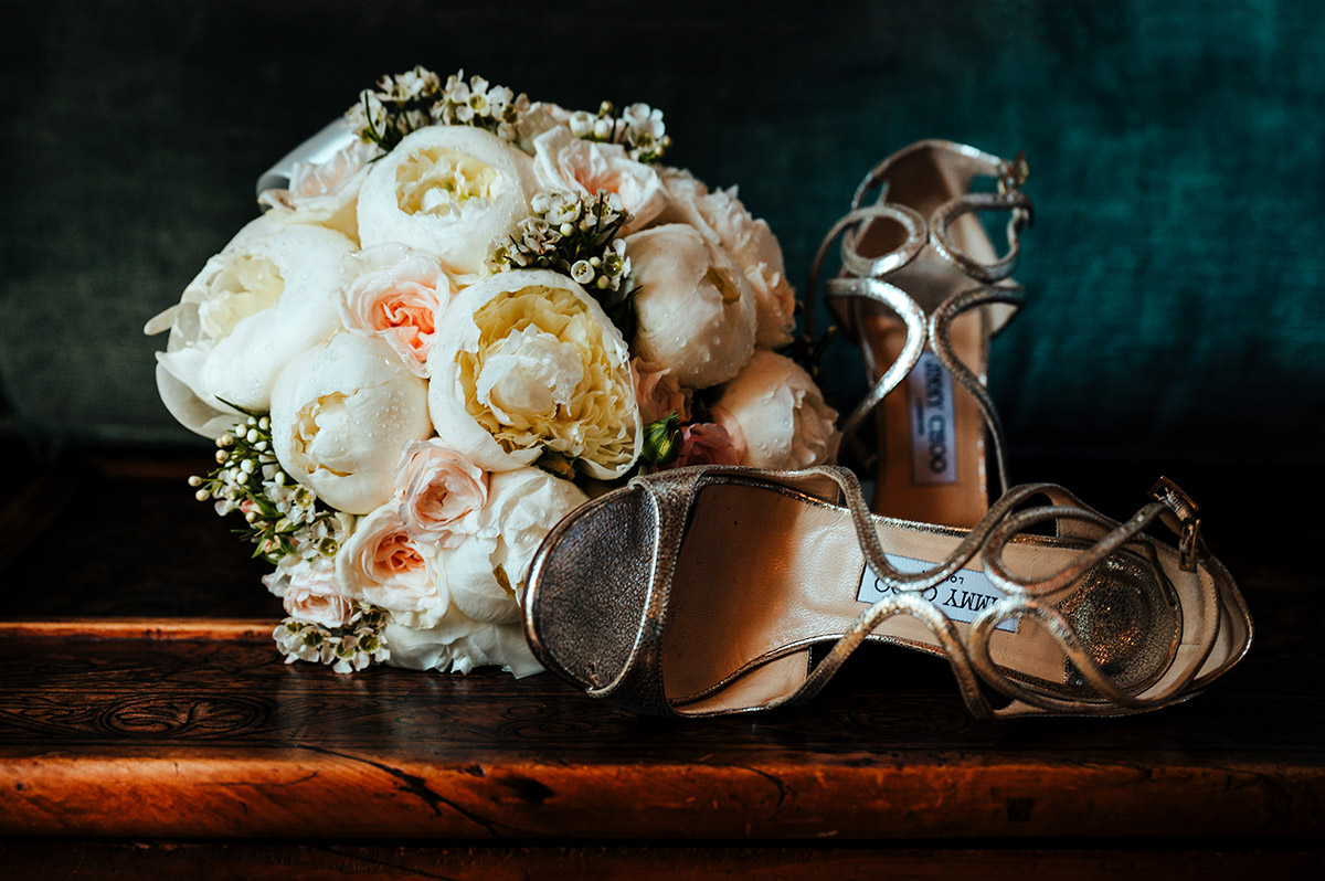 Bridal Bouquet and Designer Wedding Shoes Elegant bridal details, featuring a white peony bouquet and designer heels, for a luxurious Palazzo Confalone wedding Ravello