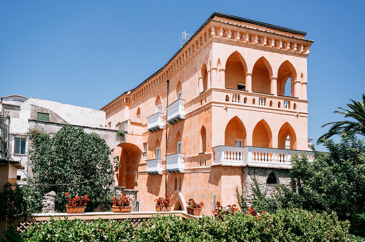 Historic Hotel Exterior in the Sun The sun shines on the beautiful historic exterior of the hotel, the perfect setting for a Palazzo Avino wedding Ravello.