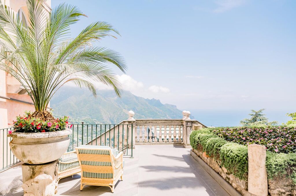 Sunlit Hotel Terrace with Sea Views A sun-drenched terrace with breathtaking sea and mountain views, an iconic feature of a Palazzo Avino wedding Ravello