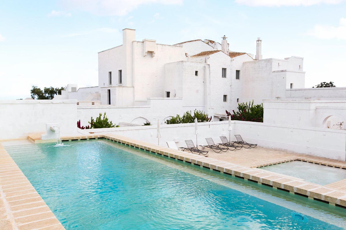 Elegant whitewashed masseria in Puglia with a serene pool, a perfect venue for a luxury wedding